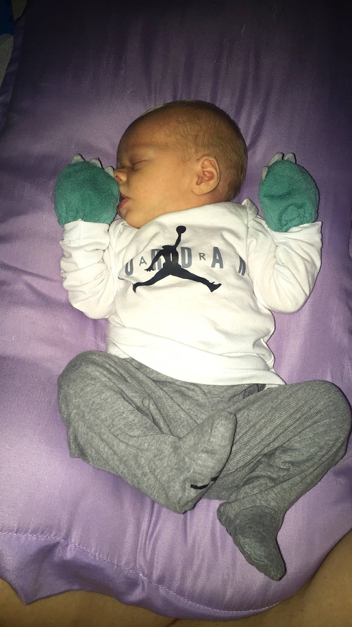 Everett is registered to the contest to win money with this photo: arm, baby, baby_toddler_clothing, cheek, child, comfort, elbow, finger, flash_photography, happy, head, human_body, iris, leg, mouth, nose, person, sitting, skin, sleeve