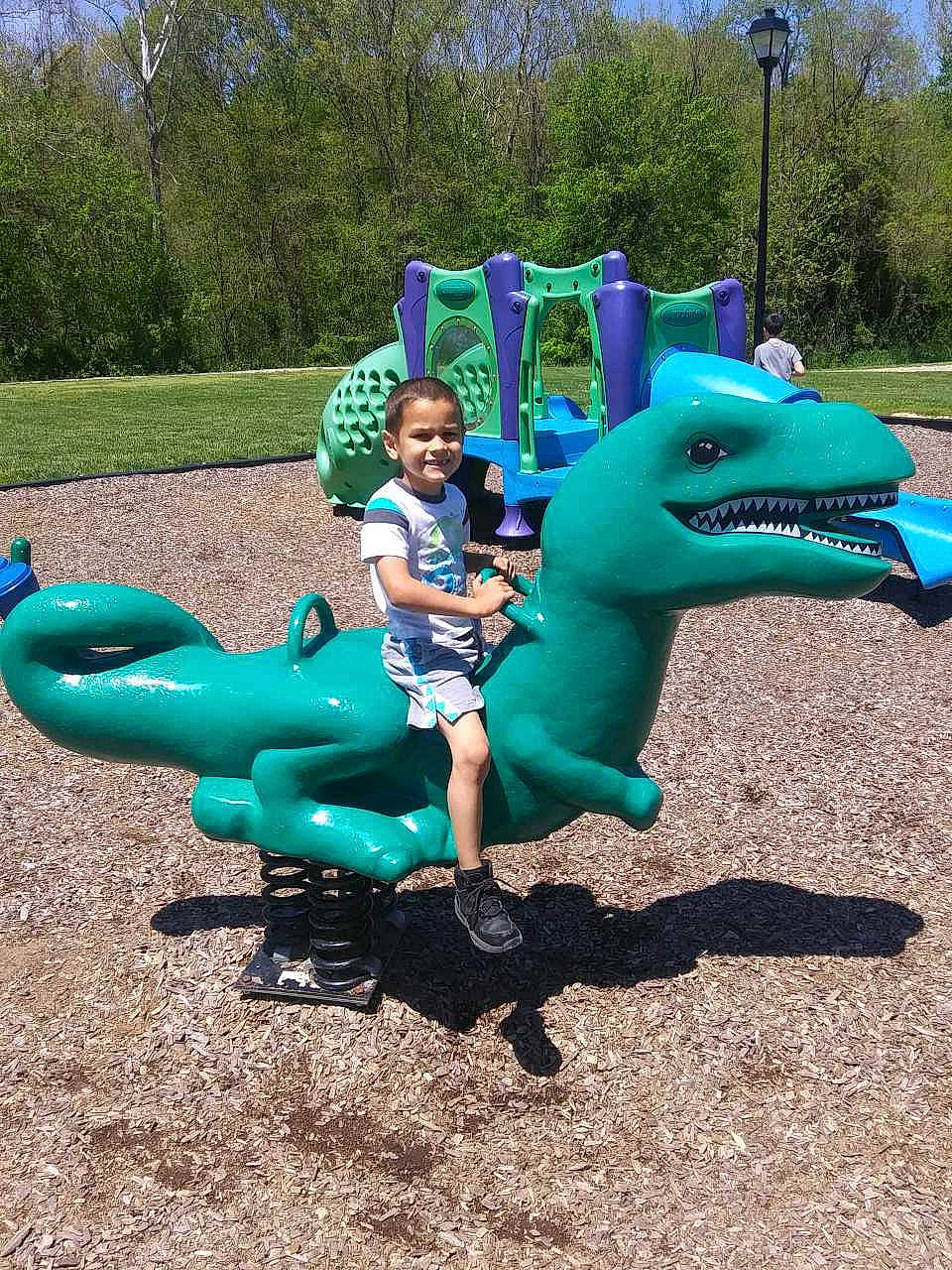 Julian joined the competition — help win amazing prizes! aqua, blue, chute, city, electric_blue, fun, grass, happy, joy, lap, leisure, outdoor_play_equipment, person, plant, playground, playground_slide, recreation, shorts, sky, smile