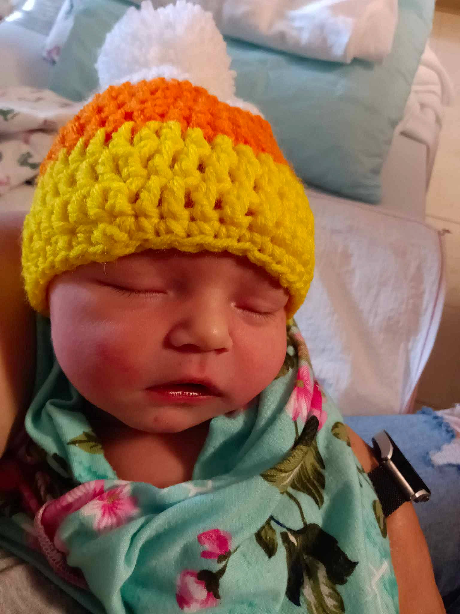 Aurora is registered to the contest to win money with this photo: art, baby, baby_toddler_clothing, beanie, cap, cheek, child, clothing, comfort, craft, crochet, fashion_accessory, head, headwear, knit_cap, linens, outerwear, person, textile, toddler