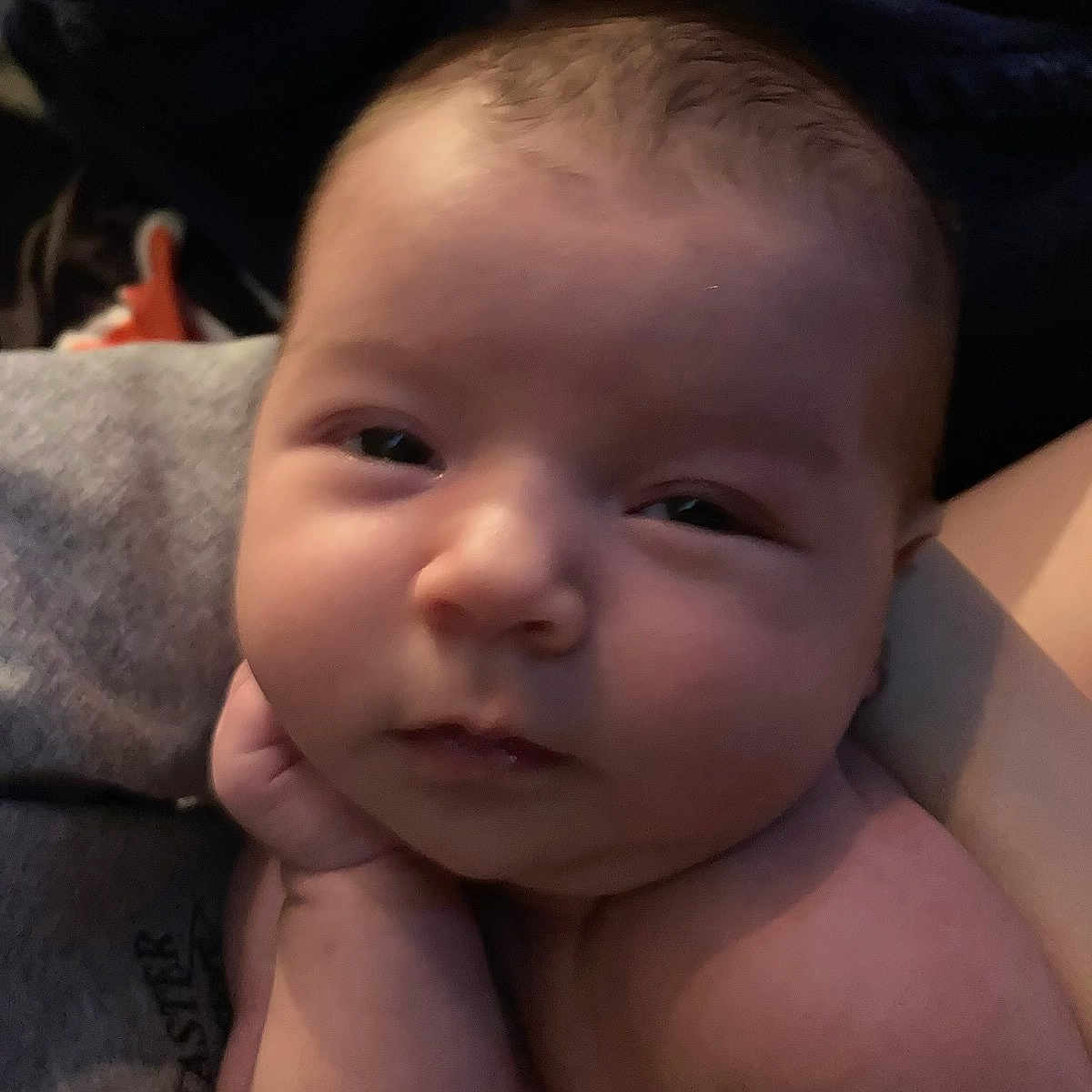 Penny is registered to the contest to win money with this photo: arm, baby, chubby, closeup, cute, expression, face, hand, head, human, indoors, infant, newborn, person, portrait, resting, skin, sleepy, soft_light, young_child