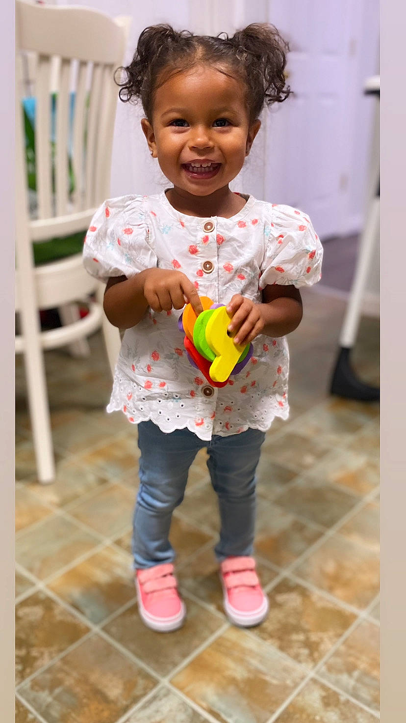 Alanna joined the competition — help win amazing prizes! baby, baby_toddler_clothing, baby_toys, beauty, child, face, flooring, fun, happy, joy, pattern, person, pink, play, room, sitting, skin, sleeve, smile, standing