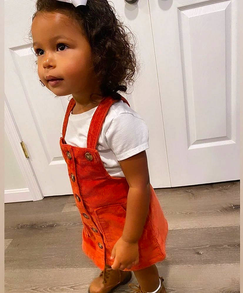 Alanna joined the competition — help win amazing prizes! baby, baby_toddler_clothing, child, clothing, day_dress, door, fashion_accessory, fashion_design, flooring, happy, human_leg, pattern, peach, person, skin, sleeve, snapshot, street_fashion, t_shirt, toddler