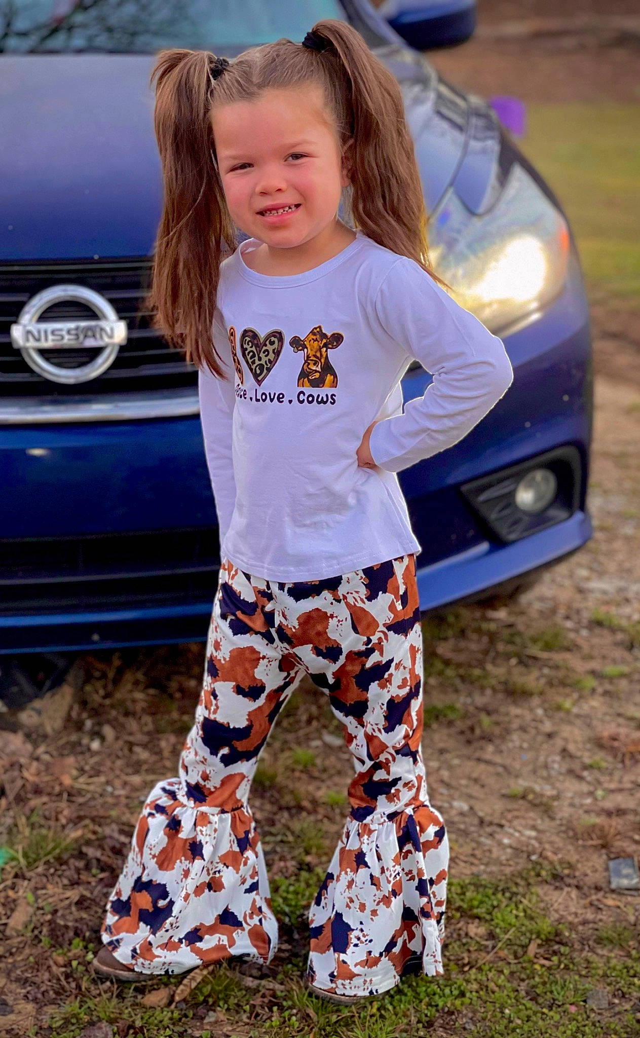Aubree joined the competition — help win amazing prizes! automotive_design, automotive_exterior, automotive_lighting, automotive_tire, board_short, bumper, car, electric_blue, face, grass, hood, joy, motor_vehicle, outerwear, person, sleeve, sportswear, t_shirt, thigh, vehicle