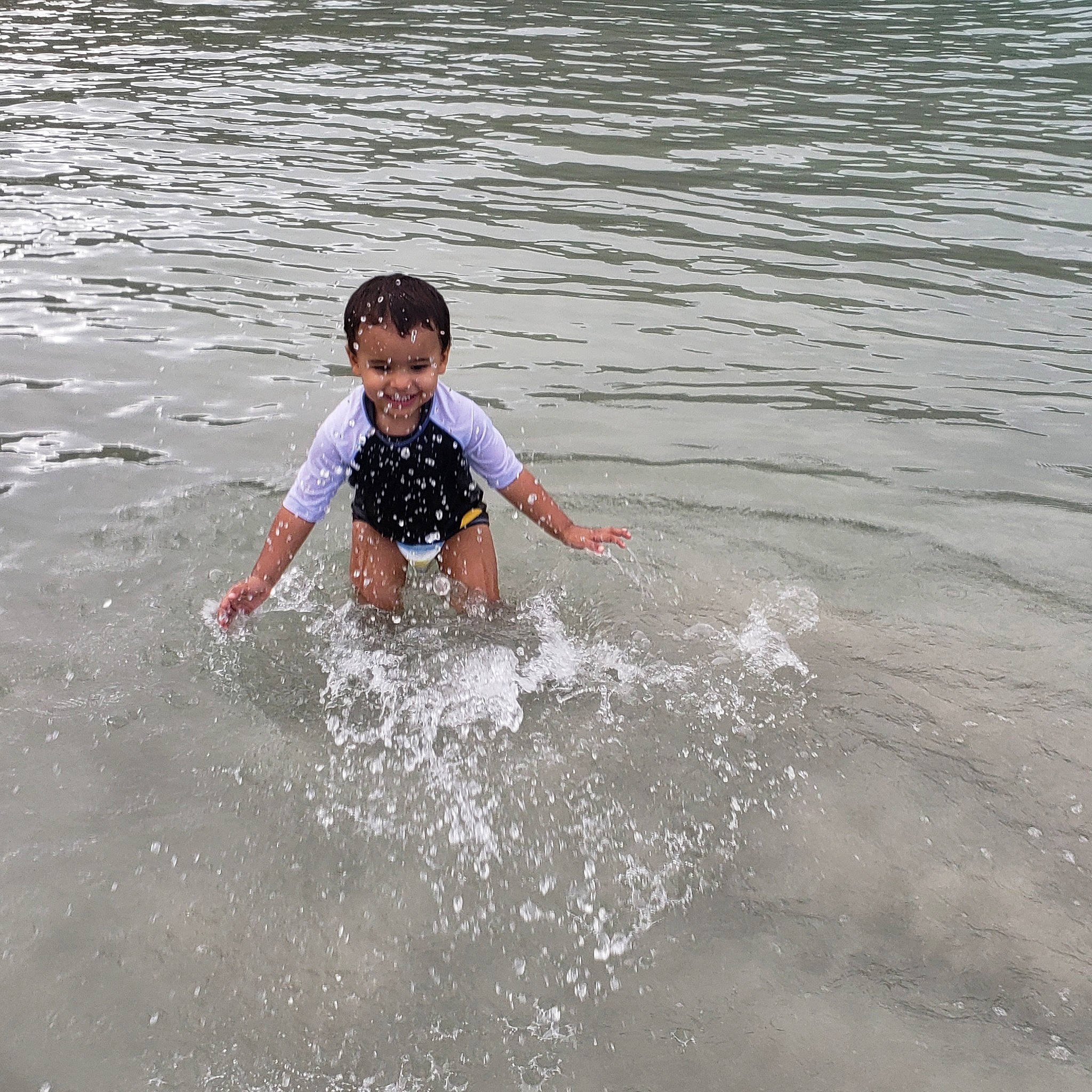 Enoch is registered to the contest to win money with this photo: bathing, beach, child, fun, happy, joy, lake, leisure, ocean, pattern, person, play, recreation, sea, smile, t_shirt, tide, toddler, vacation, water