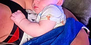 Skyler joined the competition — help win amazing prizes! baby, sleeping, blanket, blue_blanket, hand, nails, pink_nails, person, arm, couch, pillow, indoor, closeup, child, infant, rest, comfort, cozy, toddler, skin