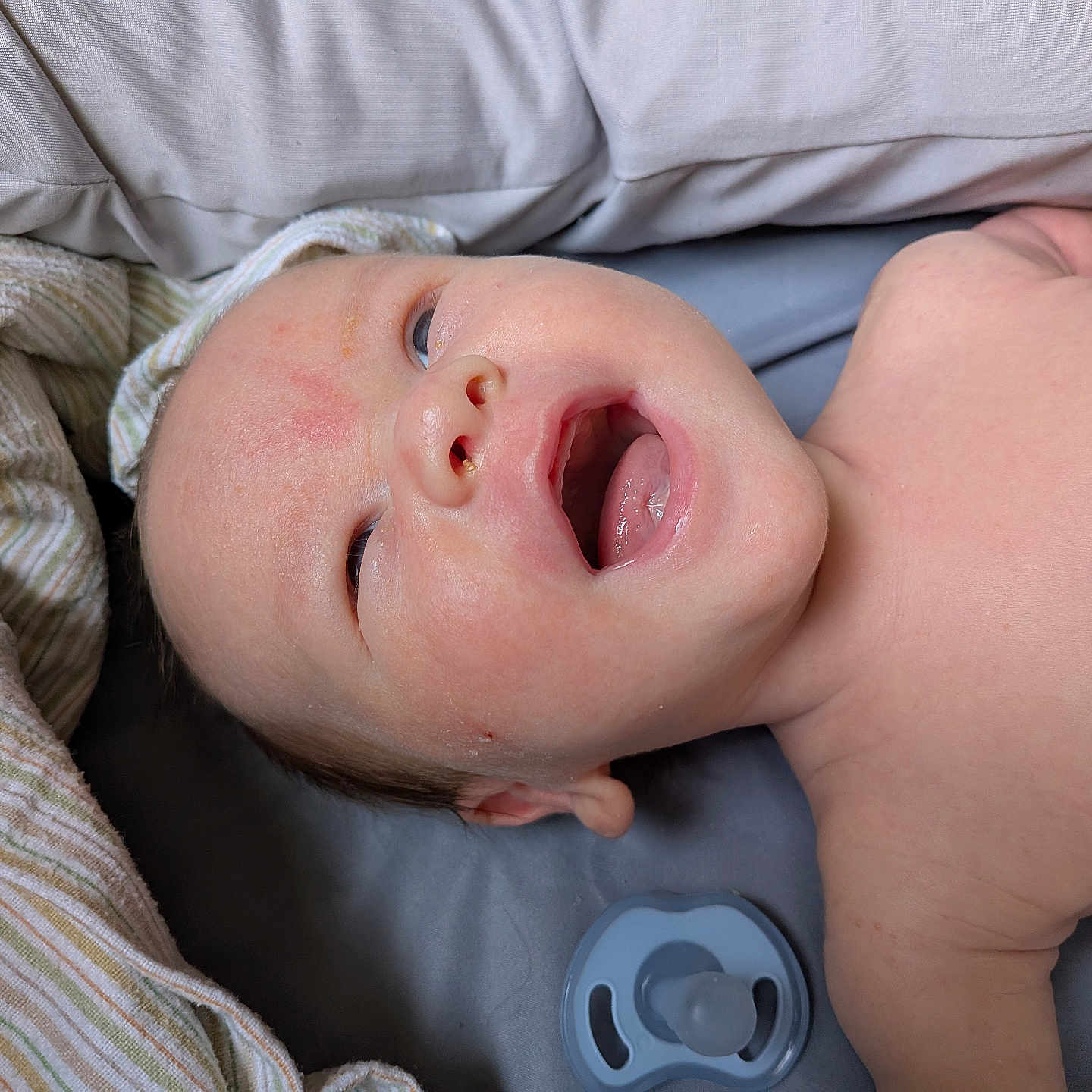 Charlie joined the competition — help win amazing prizes! baby, blanket, child, closeup, comfort, cute, expression, face, head, indoors, infant, lying_down, mouth_open, newborn, pacifier, portrait, resting, skin, sleeping_area, soft_texture