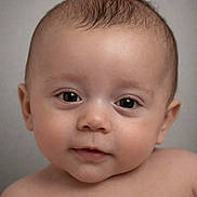 Harper joined the competition — help win amazing prizes! baby, infant, portrait, close_up, face, eyes, cheeks, skin, hair, eyelashes, bare_shoulders, looking_at_camera, cute, studio, neutral_background, expression, head, young_child, smiling_subtle, human