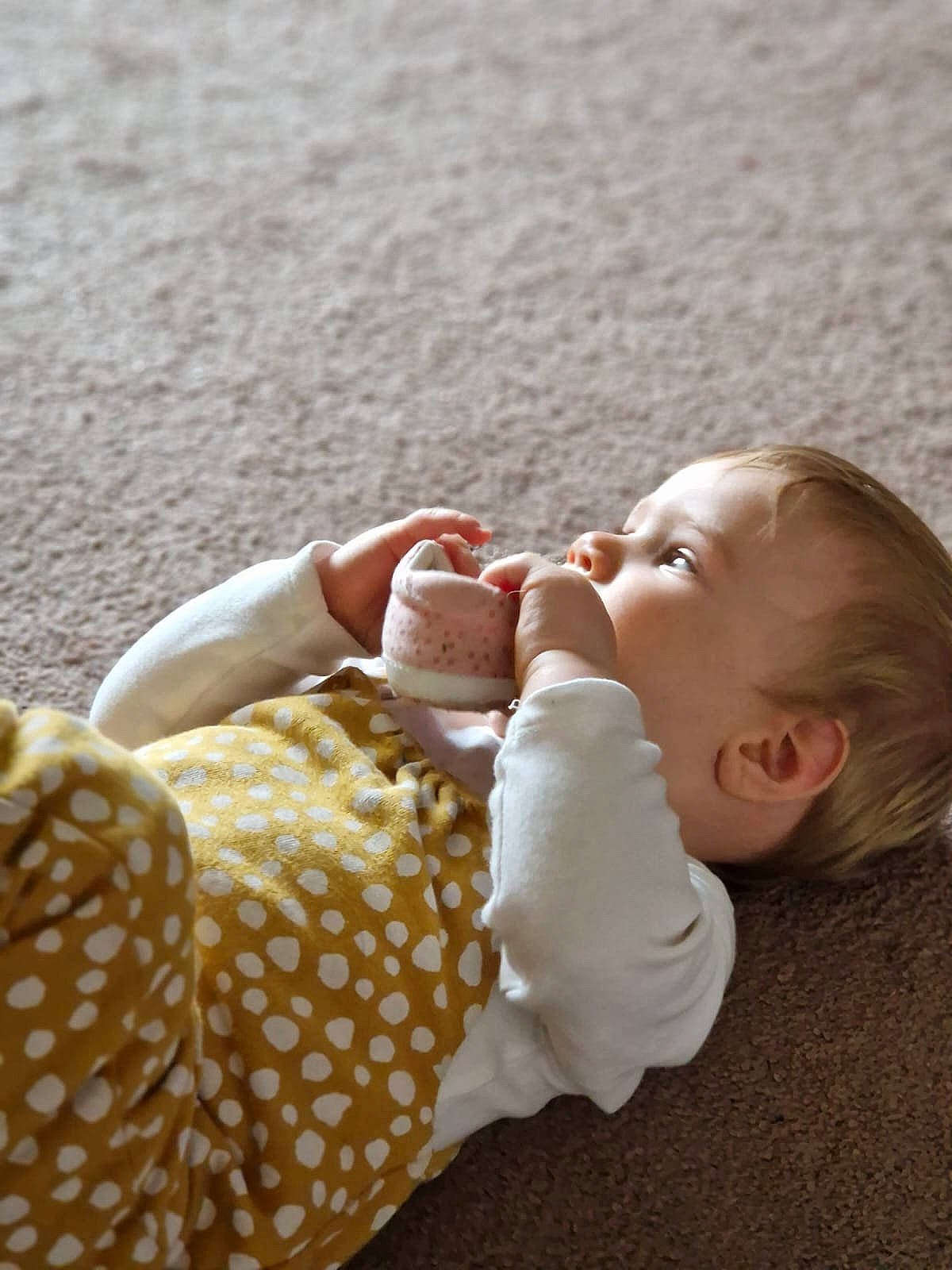 Kaitlyn is registered to the contest to win money with this photo: arm, baby, baby_toddler_clothing, beach, child, comfort, foot, grass, hand, happy, human_body, human_leg, nail, people_in_nature, person, sitting, skin, thumb, toddler, toy