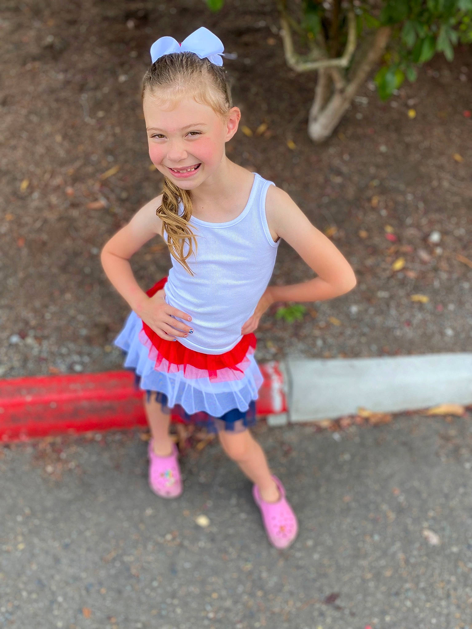 Keira is registered to the contest to win money with this photo: asphalt, baby_toddler_clothing, child, costume, electric_blue, face, fun, grass, happy, head, joy, leisure, magenta, person, personal_protective_equipment, play, recreation, smile, t_shirt, toddler