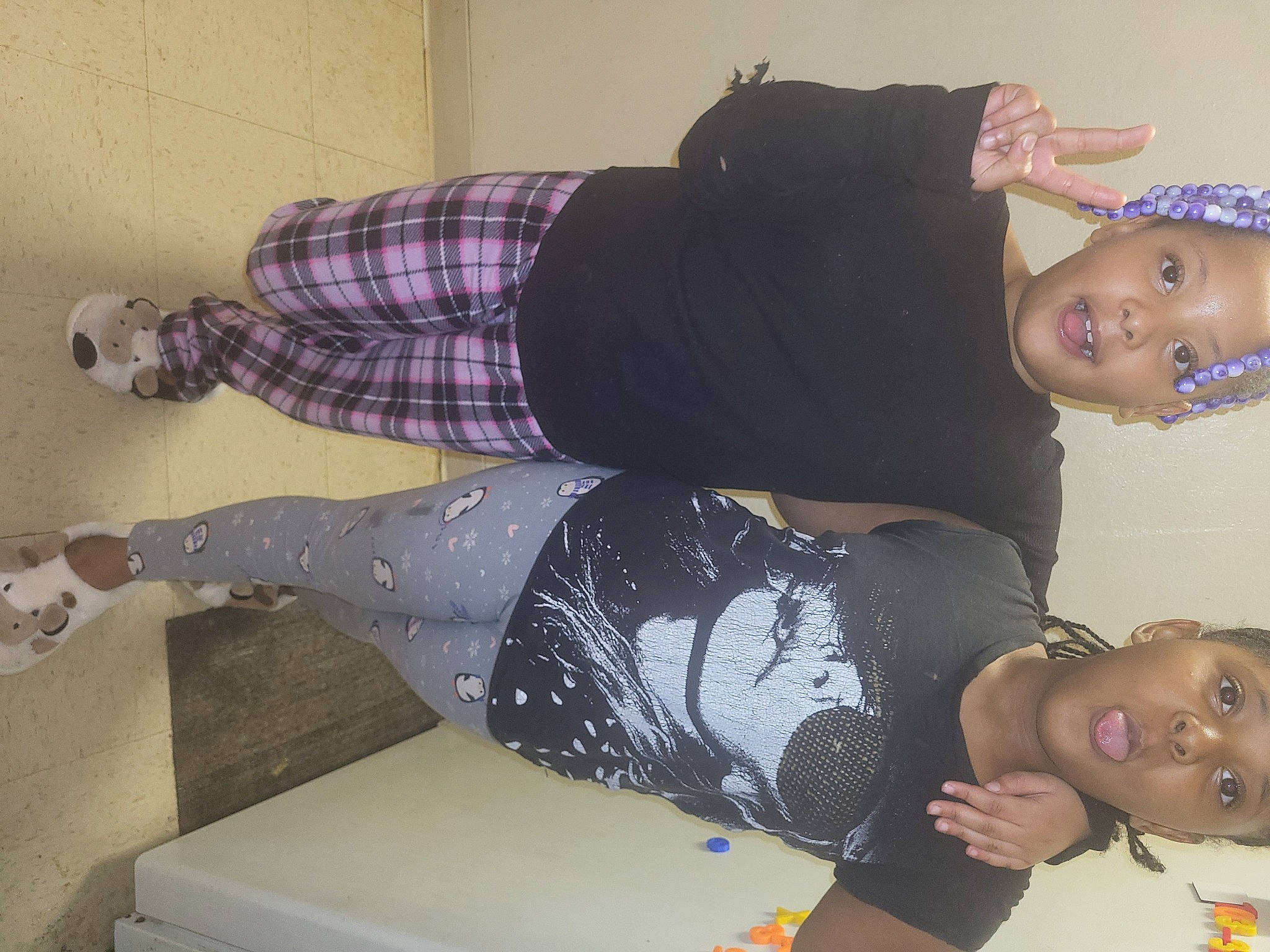 Fatima is registered to the contest to win money with this photo: baby, baby_toddler_clothing, black, comfort, elbow, happy, human_leg, joint, knee, lap, pattern, person, room, sitting, sleeve, tartan, textile, thigh, toddler, trunk