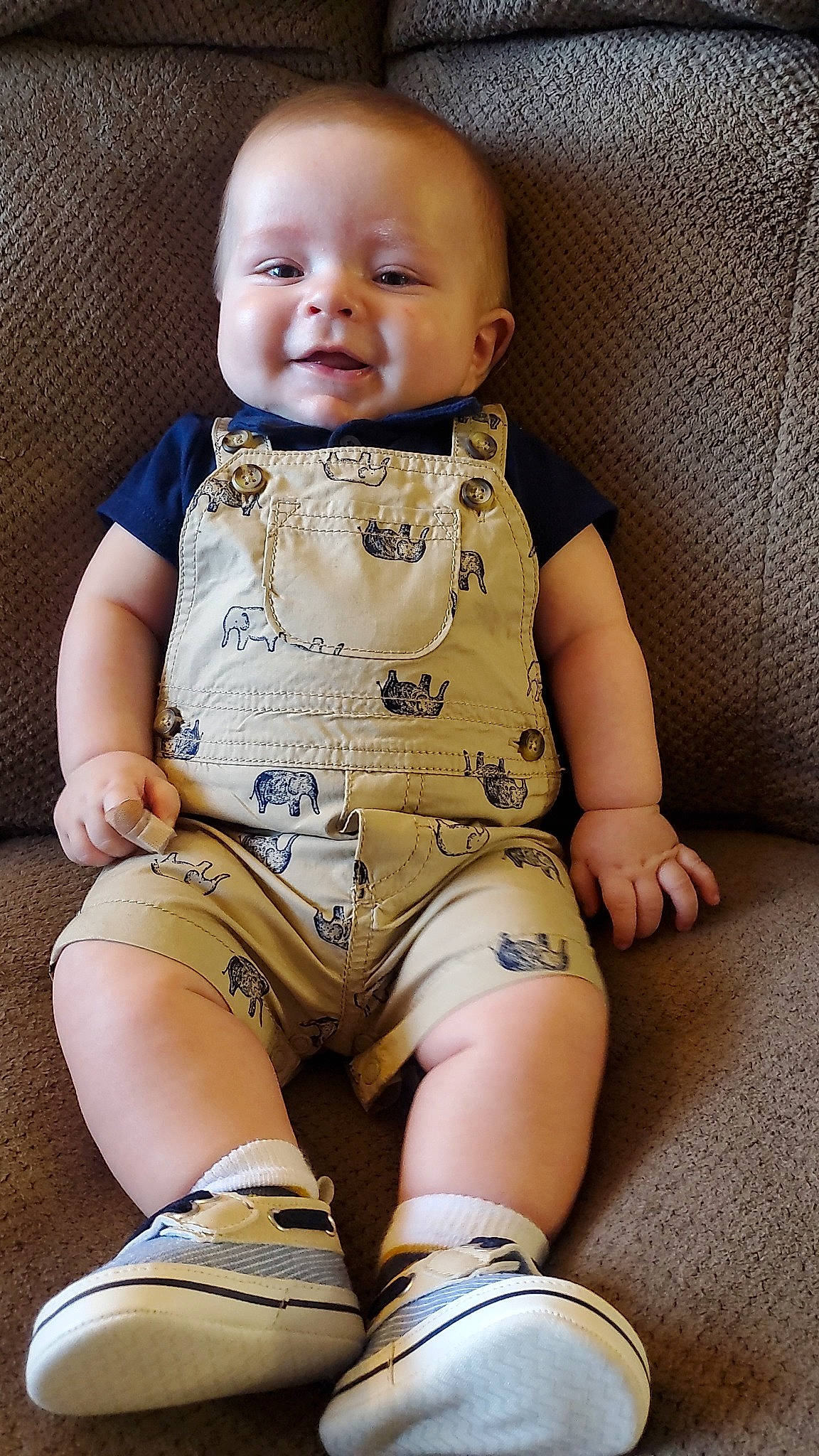 Curtis is registered to the contest to win money with this photo: baby, baby_toddler_clothing, cheek, child, comfort, eye, face, happy, head, human_leg, joint, knee, neck, person, skin, sleeve, smile, stomach, thigh, toddler