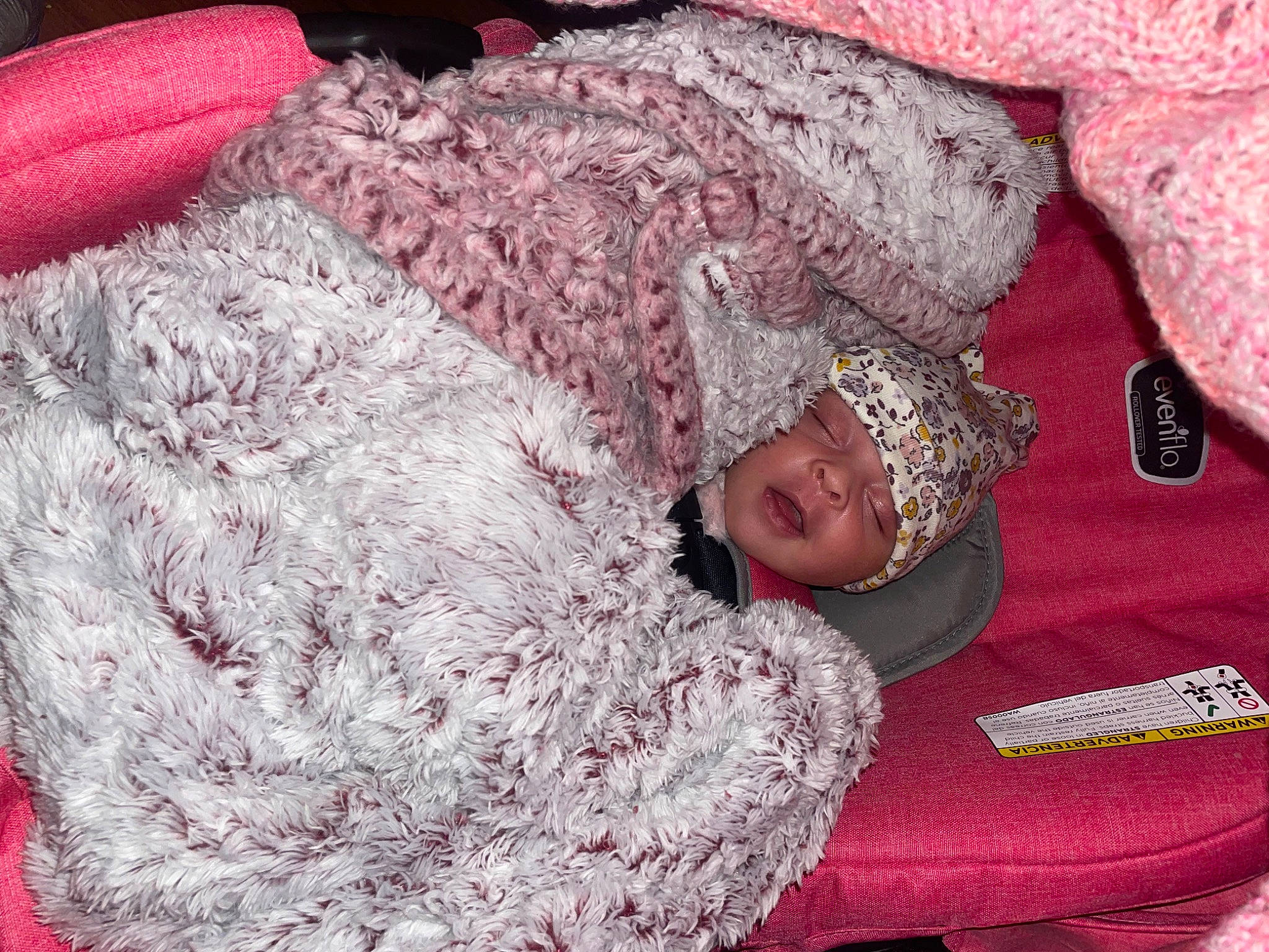 Melody is registered to the contest to win money with this photo: bed_sheet, bedding, carmine, child, comfort, couch, fur, happy, headwear, linens, magenta, pattern, person, pink, purple, red, sleeve, smile, textile, toddler