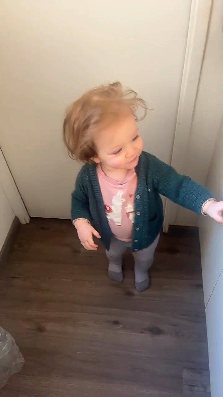 Lilya participe au concours pour gagner de l'argent avec cette photo : baby, baby_toddler_clothing, cheek, child, crawling, dress, floor, flooring, fun, hardwood, knee, person, room, sitting, skin, sleeve, toddler, varnish, wood, wood_flooring