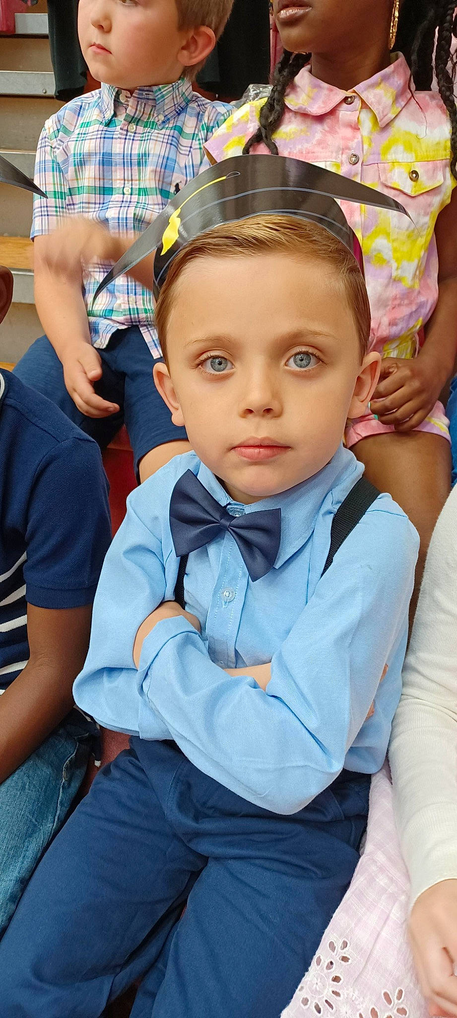 Kamden is registered to the contest to win money with this photo: baby, chair, child, electric_blue, event, fashion_accessory, fun, happy, leisure, person, recreation, room, sitting, tie, toddler, tradition, uniform, vacation