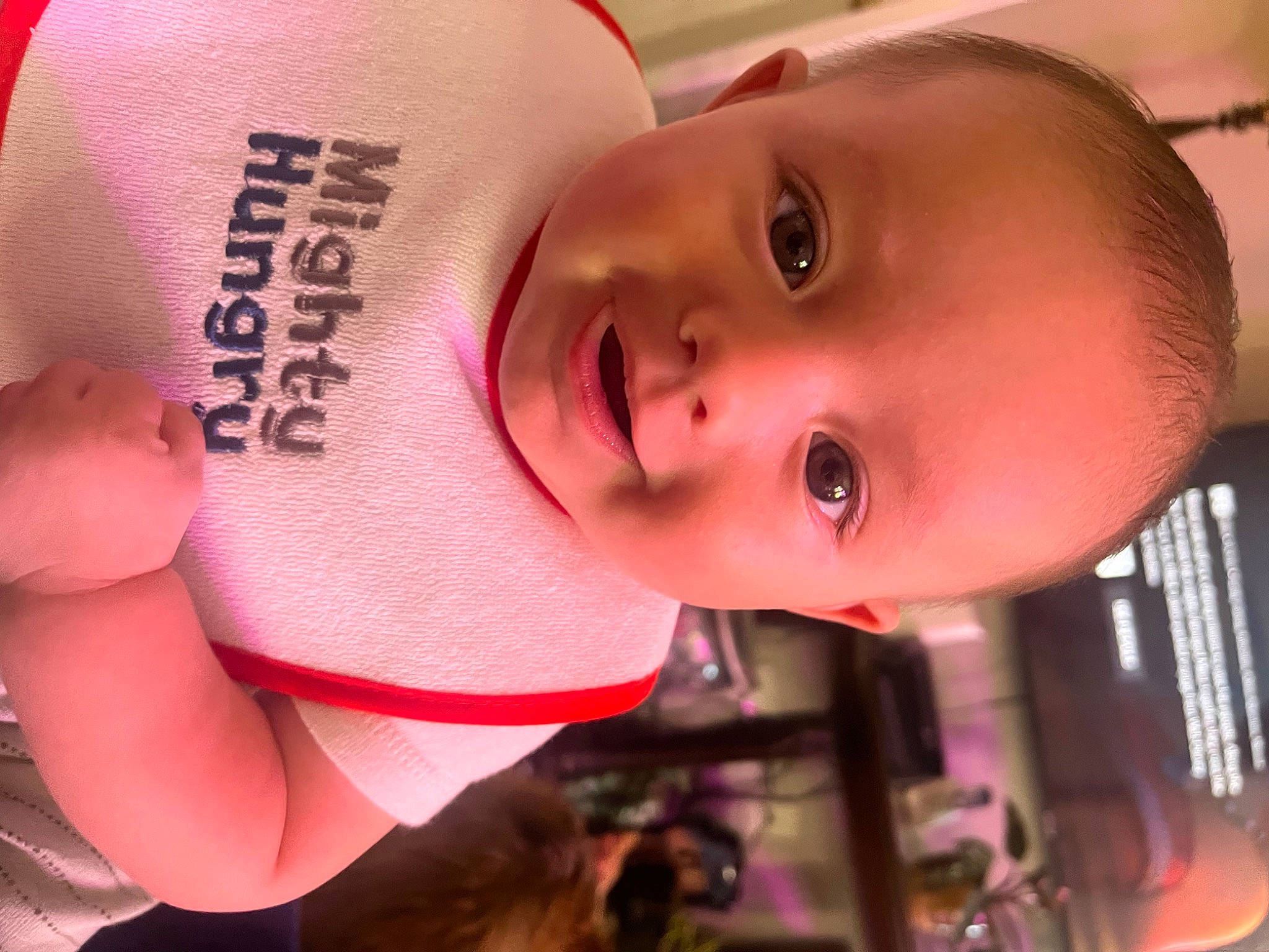 Landen is registered to the contest to win money with this photo: baby, cap, cheek, chin, eye, eyebrow, eyelash, facial_expression, forehead, happy, hat, human_body, lip, mouth, neck, nose, person, pink, skin, smile