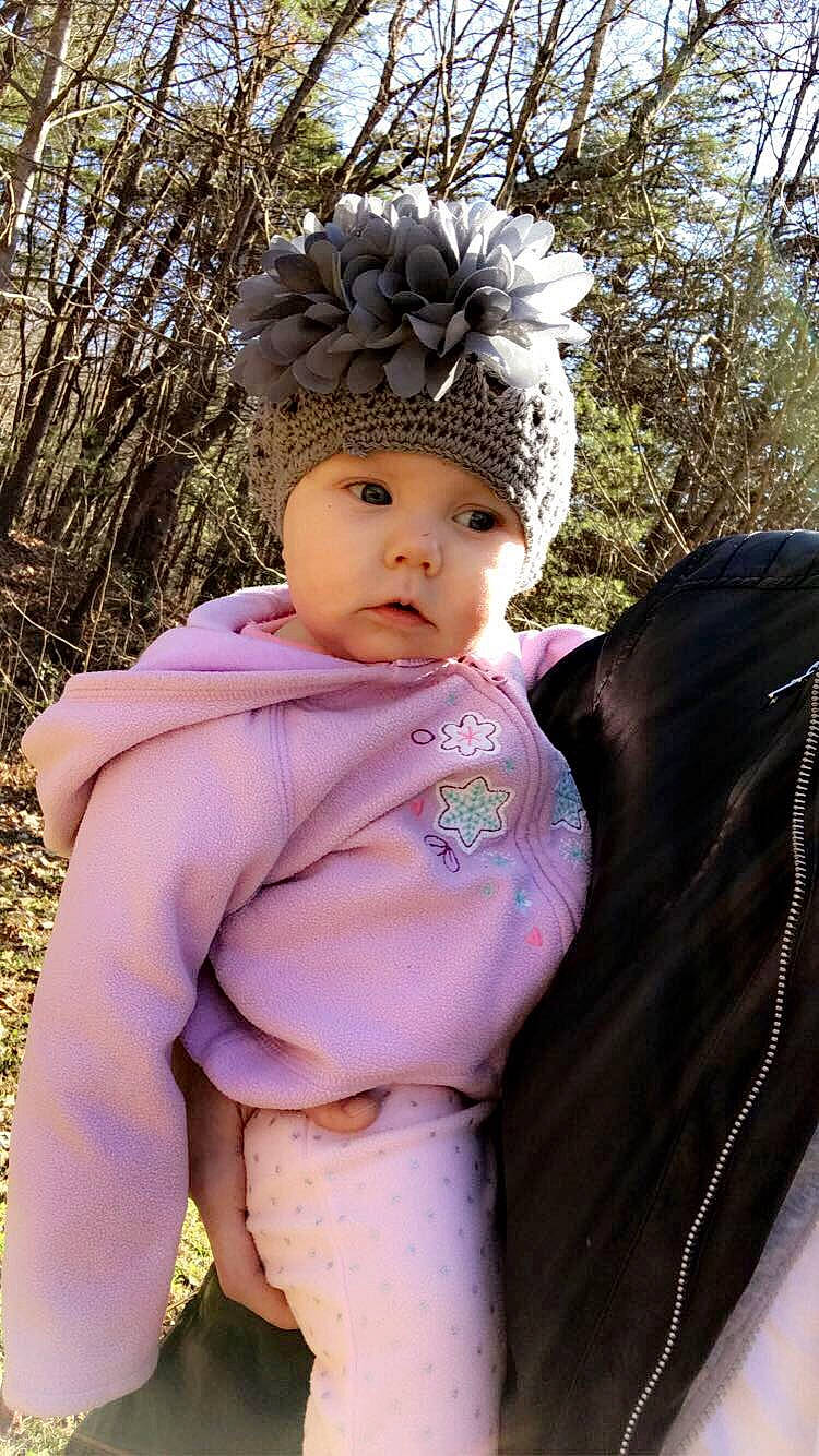 Macy is registered to the contest to win money with this photo: baby, baby_products, child, fashion_accessory, fawn, fur, hair_accessory, headband, headgear, headpiece, person, pink, product, purple, toddler
