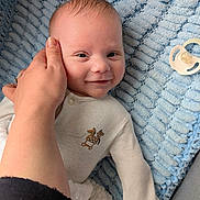 Jensen joined the competition — help win amazing prizes! baby, infant, hand, smile, blanket, pacifier, clothing, person, face, cute, texture, comfort, child, toddler, blue, cozy, soft, resting, happy, gentle