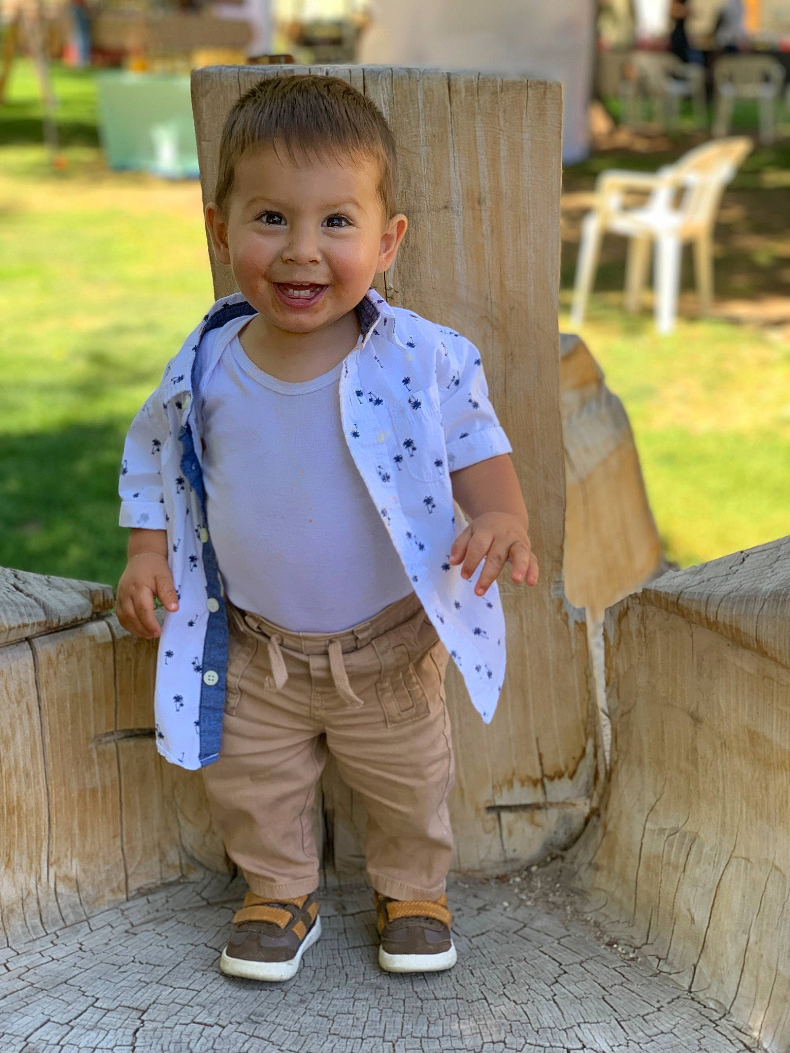 Eli joined the competition — help win amazing prizes! baby_toddler_clothing, chair, child, city, denim, footwear, fun, grass, happy, joy, leisure, person, plant, play, recreation, sitting, sleeve, smile, t_shirt, toddler