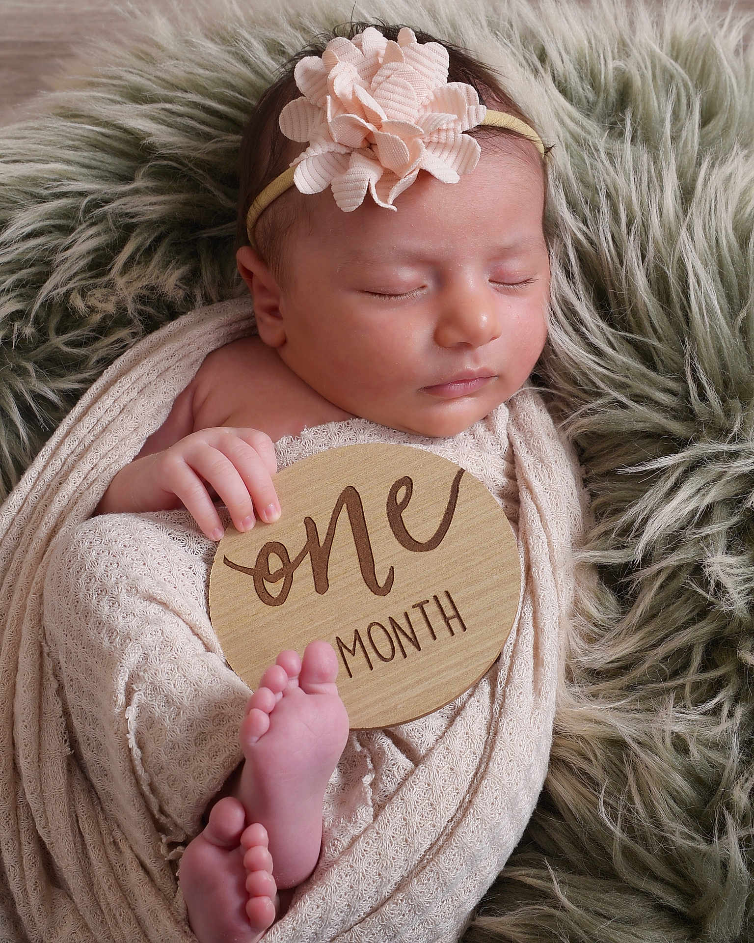 Isla joined the competition — help win amazing prizes! baby, infant, newborn, sleeping, blanket, headband, flower, wooden_sign, one_month, feet, hand, cozy, soft_texture, fur_rug, wrapped, portrait, cute, peaceful, resting, indoors