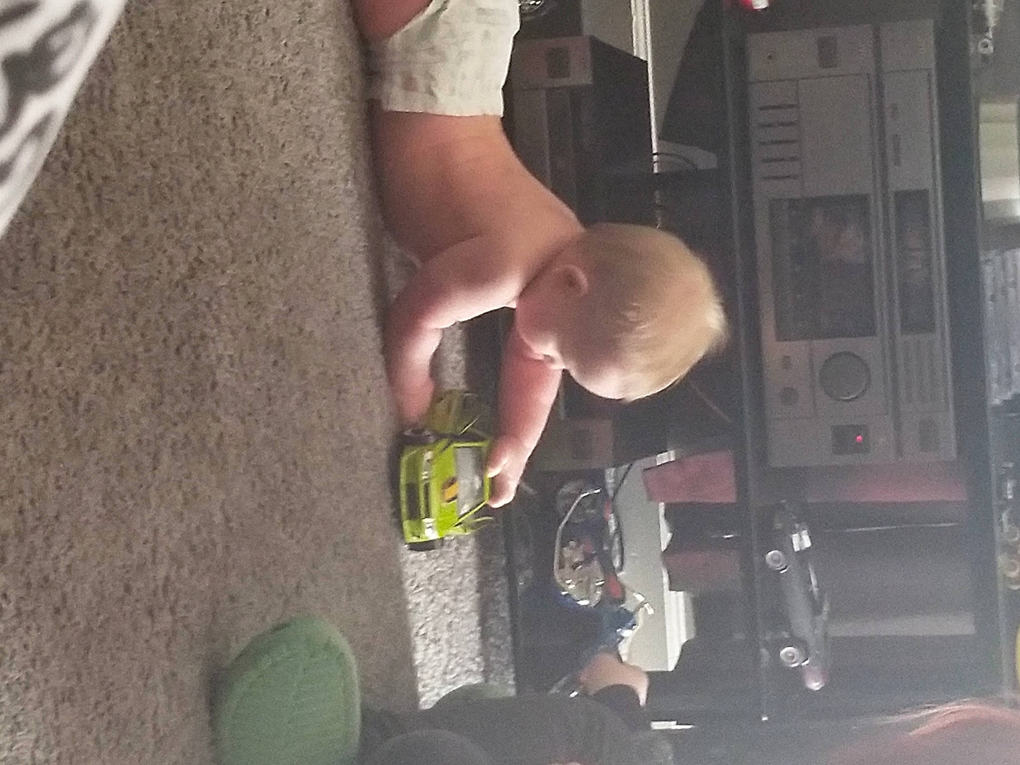 Kannon joined the competition — help win amazing prizes! abdomen, baby, black, chest, child, elbow, flooring, foot, fun, gesture, house, human_leg, leg, nail, person, room, sitting, t_shirt, thigh, toddler