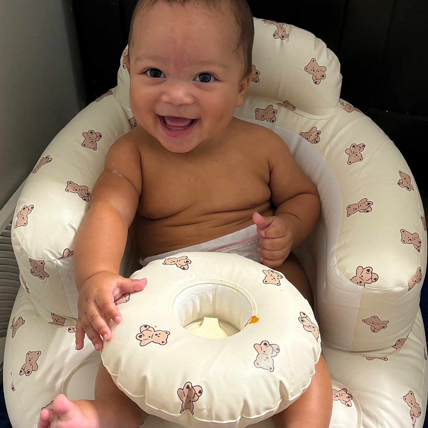 Syaire joined the competition — help win amazing prizes! baby, bare_chest, blue_floor, child, cute, diaper, expression, face, foot, hand, happy, indoors, infant, inflatable_chair, joy, playful, sitting, skin, smile, teddy_bear_pattern