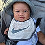 Syaire joined the competition — help win amazing prizes! baby, child, hat, bib, stroller, straps, face, smile, clothing, infant, seatbelt, cute, portrait, young, outdoor, sunhat, babywear, white_shirt, closeup, happy