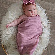 Alaia joined the competition — help win amazing prizes! baby, infant, pink_bow, blanket, fluffy_rug, basket, wooden_floor, headband, cute, chubby_cheeks, wrapped, lying_down, indoors, soft_texture, portrait, closeup, child, adorable, peaceful, small_hand