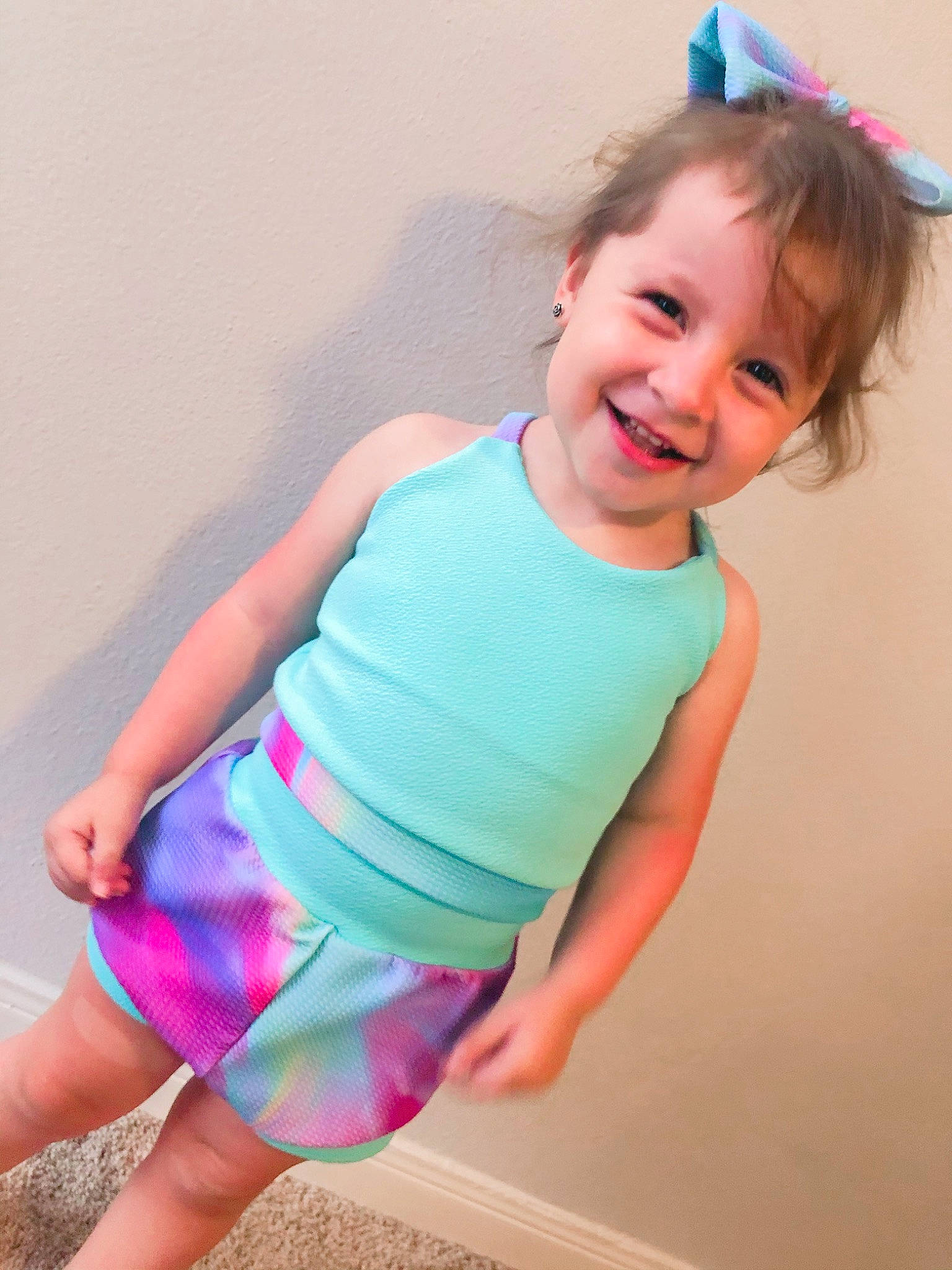 Juliana joined the competition — help win amazing prizes! baby, baby_toddler_clothing, child, clothing, costume, dress, joy, neck, pattern, person, pink, play, purple, smile, sportswear, t_shirt, toddler, turquoise, vacation