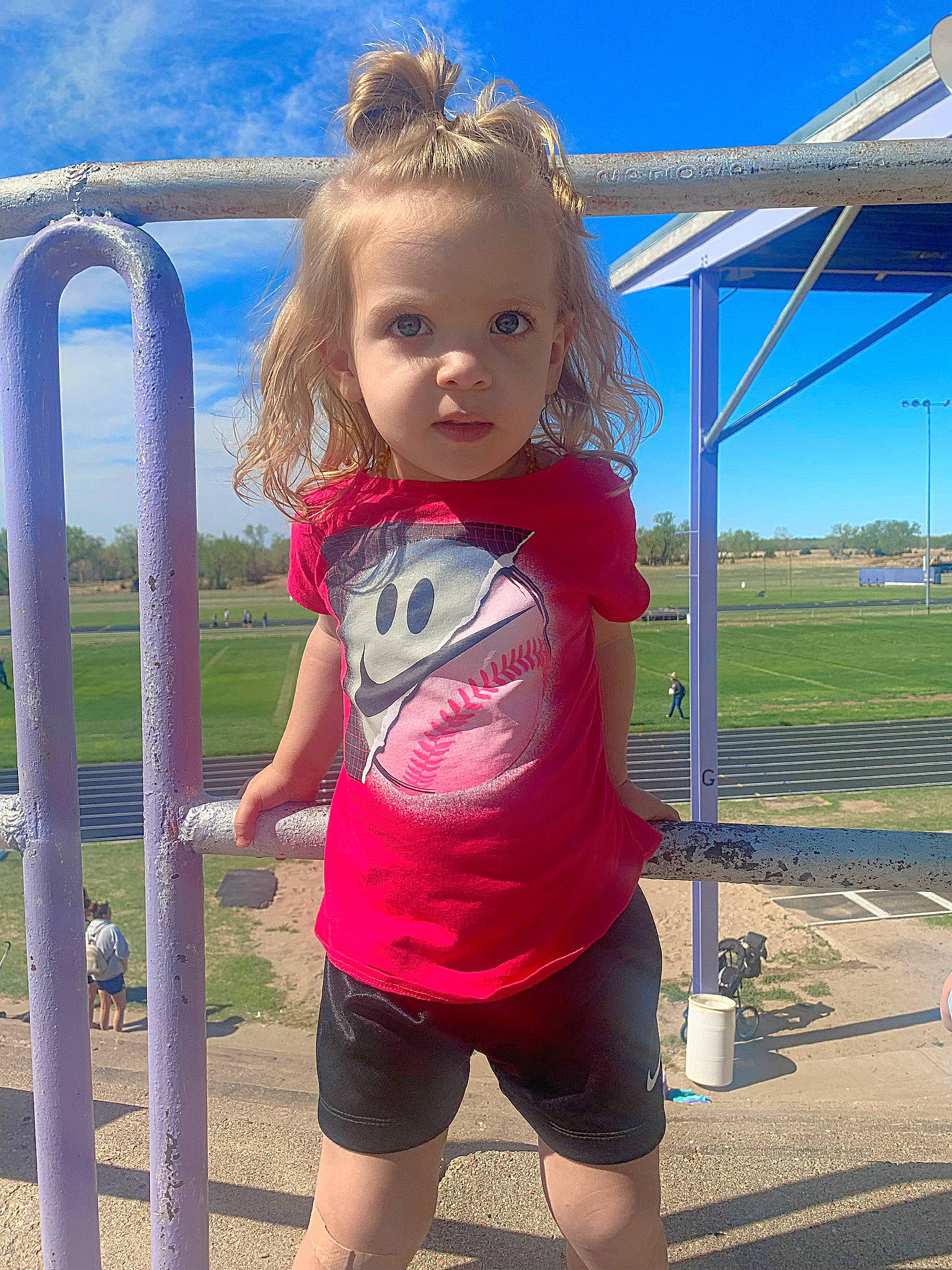 Nayvie is registered to the contest to win money with this photo: baby_toddler_clothing, blue, chin, electric_blue, face, fun, hair, happy, head, human_body, leisure, person, pink, playground, sky, sleeve, smile, standing, thigh, toddler