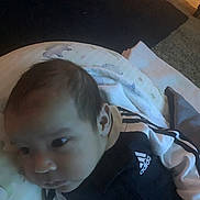 Dwayne joined the competition — help win amazing prizes! adidas, apparel, baby, blanket, carpet, clothing, curious, door, face, floor, head, indoor, infant, person, pillow, resting, soft_lighting, toddler, wall, young_child