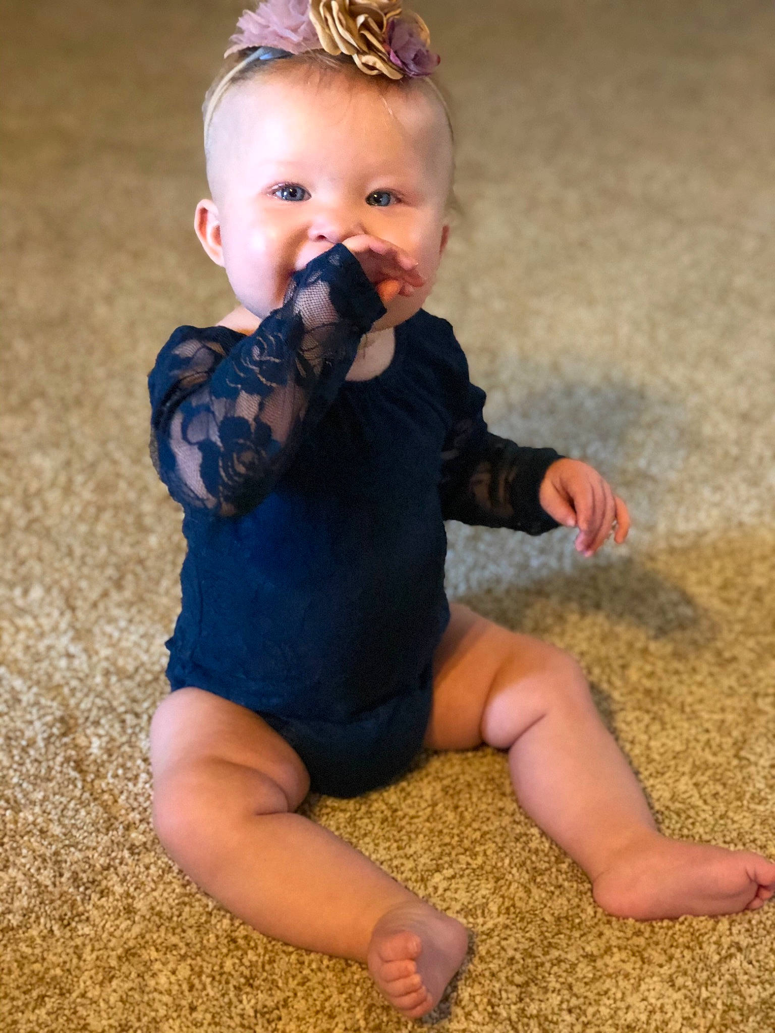 Mireya is registered to the contest to win money with this photo: arm, baby, barefoot, blond, cheek, child, eye, finger, fun, leg, person, photography, play, sitting, skin, toddler, vacation