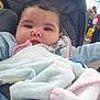 baby, infant, child, blanket, stroller, outdoor, people, crowd, trees, clothing, warm, cute, face, expression, comfort, seated, portrait, daylight, soft, bundle
