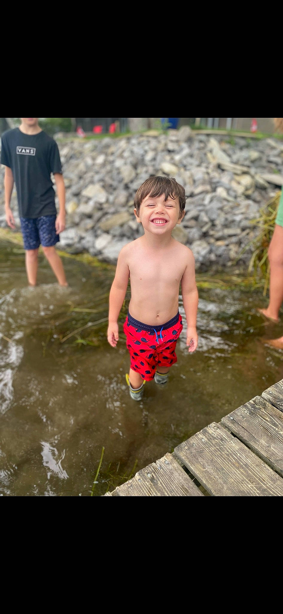 Kayden joined the competition — help win amazing prizes! barechested, barefoot, bathing, body_of_water, chest, child, fun, grass, happy, joy, leisure, person, play, recreation, shorts, smile, t_shirt, toddler, trunks, water