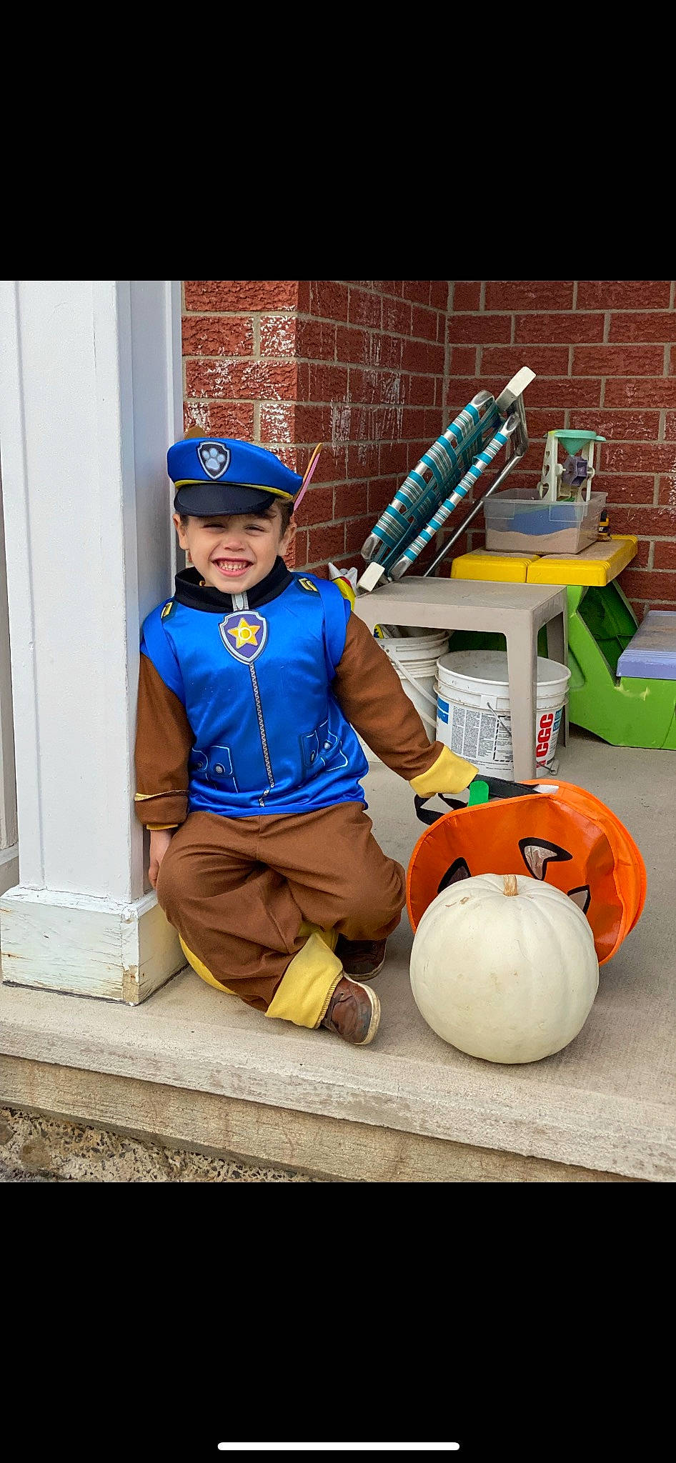 Kayden is registered to the contest to win money with this photo: baseball_cap, blue_collar_worker, boot, brick, brickwork, cap, child, construction_worker, door, electric_blue, glove, goggles, hat, headwear, helmet, joy, person, personal_protective_equipment, shorts, smile
