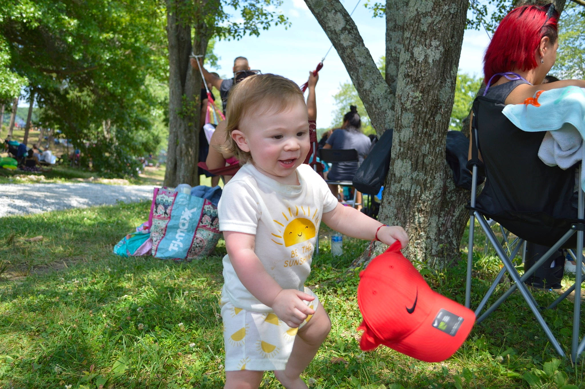 Emin is registered to the contest to win money with this photo: backpack, bag, blurred, child, event, fun, garden, grass, happy, lawn, leisure, luggage_and_bags, person, plant, recreation, sitting, smile, summer, toddler, toy