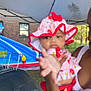 Jasmine joined the competition — help win amazing prizes! baby, child, person, hat, pink, red, outdoor, inflatable_slide, canopy_tent, adult, grass, summer, play, sun_hat, clothing, holding, daylight, fun, recreation, family