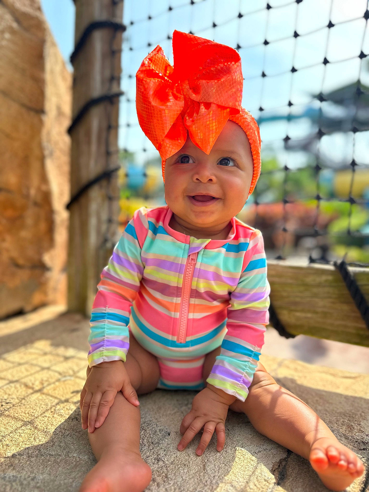 Zylah joined the competition — help win amazing prizes! baby, baby_toddler_clothing, child, eye, face, fashion_accessory, flooring, fun, grass, happy, head, headwear, landscape, leisure, pattern, peach, person, sitting, skin, sleeve