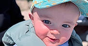 Mahëlo participe au concours pour gagner de l'argent avec cette photo : baby, child, smiling, cap, hat, blue_sky, outdoor, vest, puffy_jacket, close_up, face, happy, sunlight, cute, person, portrait, daylight, casual_clothing, headwear, infant