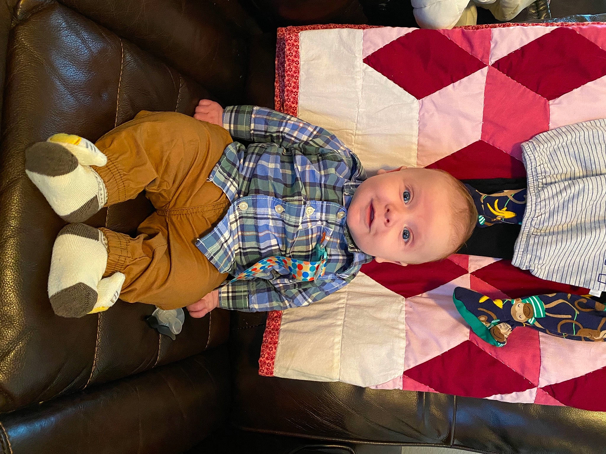 Everett joined the competition — help win amazing prizes! baby, baby_products, baby_toddler_clothing, carmine, child, comfort, couch, event, hat, head, lap, linens, pattern, person, plaid, room, sitting, smile, textile, toddler