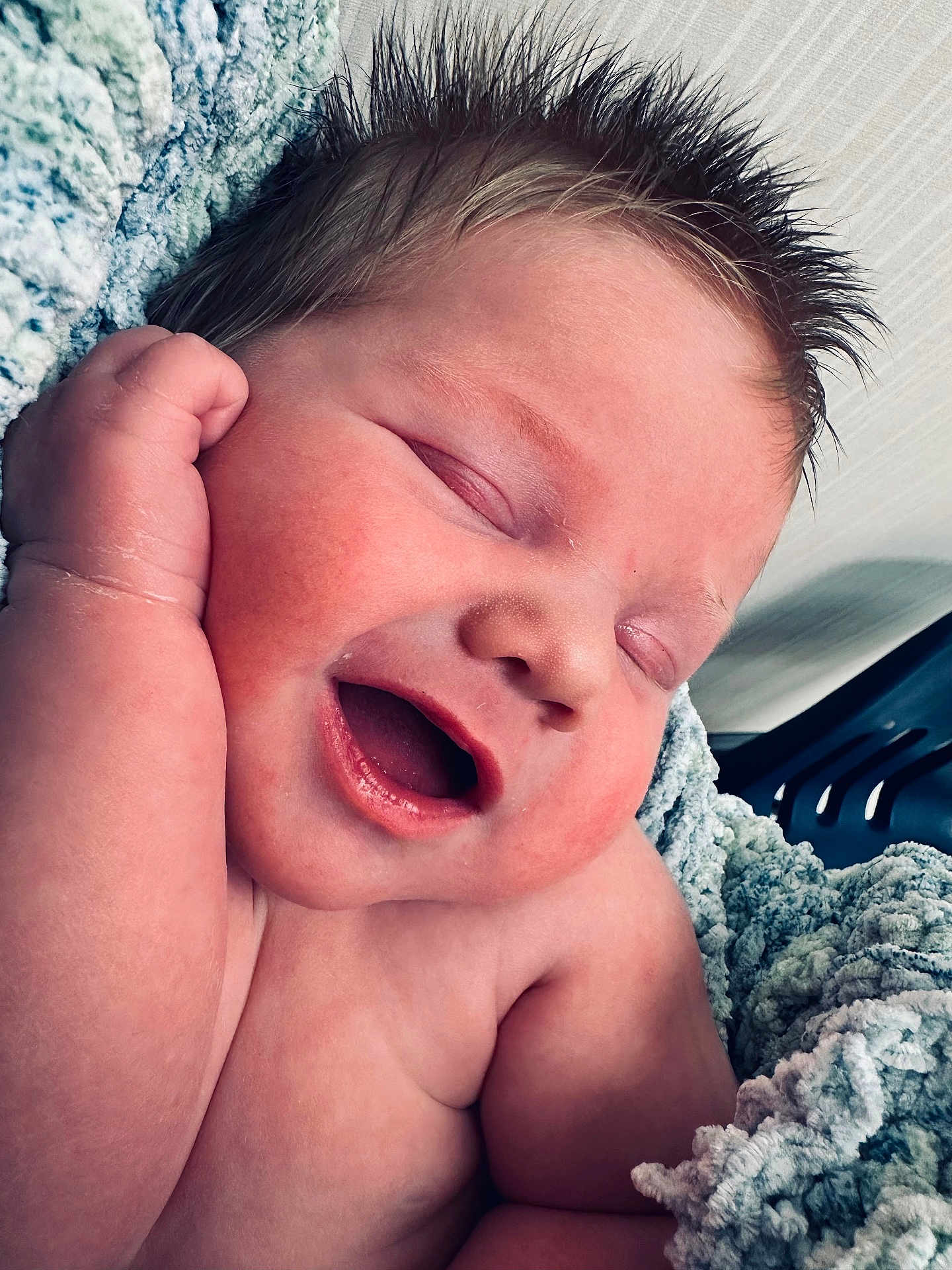 Brian joined the competition — help win amazing prizes! baby, newborn, infant, sleeping, smiling, face, cheek, hand, spiky_hair, hair, mouth_open, cozy_blanket, soft_texture, closeup, portrait, skin, peaceful, relaxed, indoor, nursery