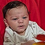Kays participe au concours pour gagner de l'argent avec cette photo : animal_print, baby, child, closeup, confused, curious, cute, expression, face, hair, head, indoors, infant, person, portrait, red_background, sitting, skin, white_clothing, young
