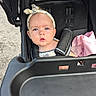 Brynlee joined the competition — help win amazing prizes! baby, child, infant, stroller, portrait, outdoor, sitting, face, blue_eyes, headband, blanket, pink_blanket, harness, baby_seat, pavement, daylight, looking_at_camera, clothing, calm, photography