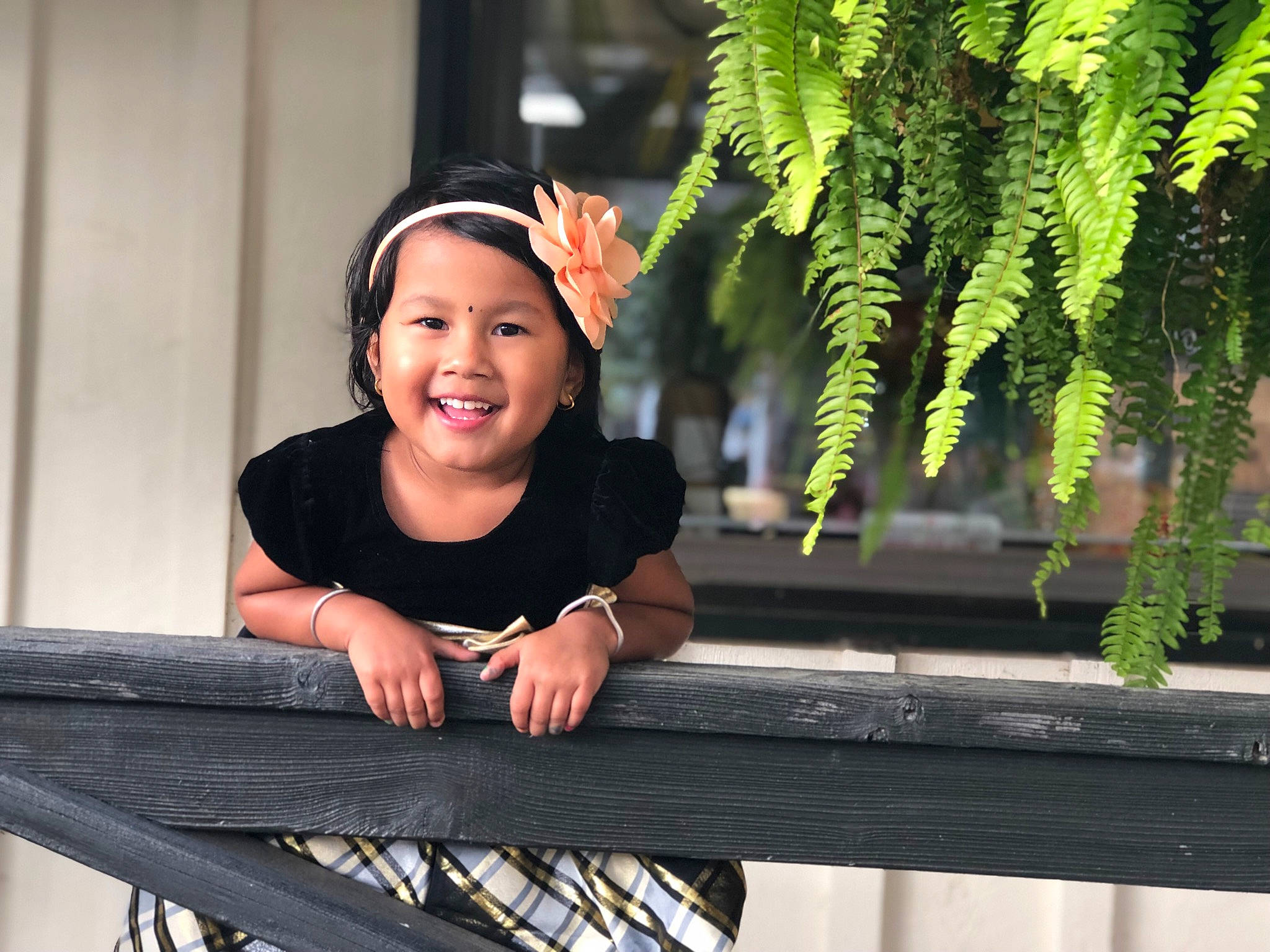 Prisha is registered to the contest to win money with this photo: beauty, botany, child, cool, facial_expression, finger, green, hand, happy, human, iron, joy, laugh, leisure, person, photo_shoot, photography, plant, sitting, smile