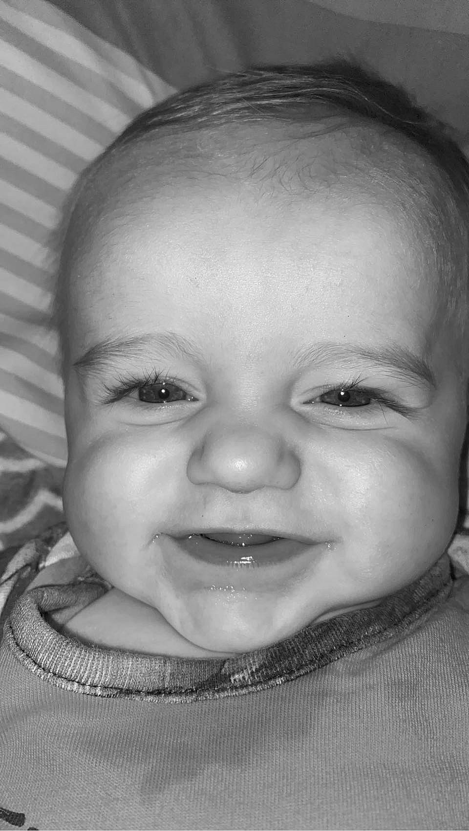 Shane is registered to the contest to win money with this photo: baby, black, black_and_white, cheek, chin, ear, eye, eyebrow, eyelash, flash_photography, happy, human_body, iris, jaw, lip, mouth, nose, person, skin, smile