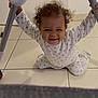 toddler, child, curly_hair, smiling, sitting, floor, tiles, high_chair, white_clothing, indoor, baby, hands, legs, furniture, expression, cute, happy, young_child, playful, home