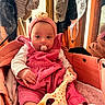 Victoire participe au concours pour gagner de l'argent avec cette photo : baby, pacifier, giraffe_toy, pink_clothing, headband, stroller, reflection, mirror, clothing, indoor, child, toy, seated, warm_lighting, corduroy, cute, infant, person, portrait, soft_texture