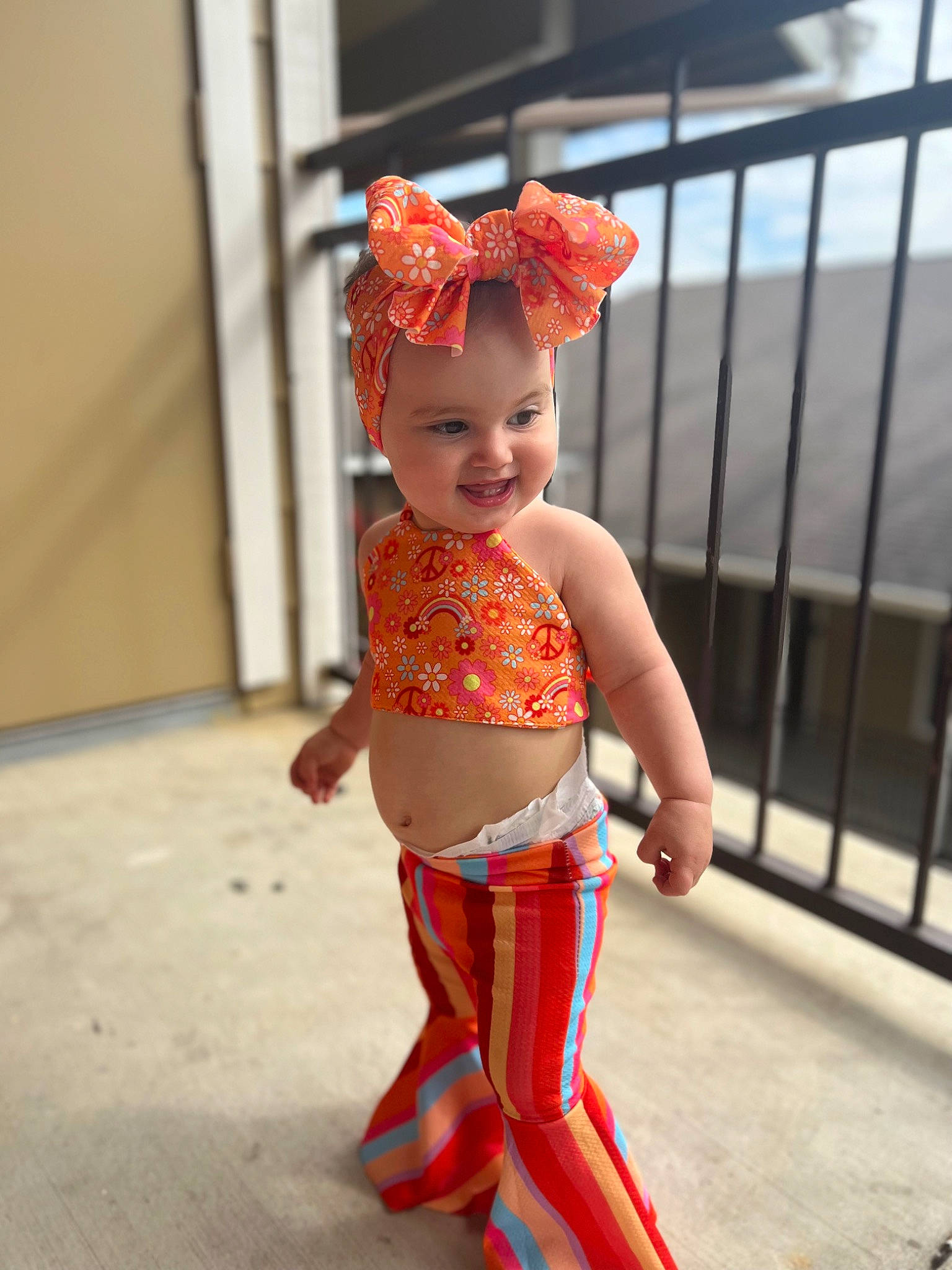 Leighton joined the competition — help win amazing prizes! abdomen, baby_toddler_clothing, costume, electric_blue, face, fence, fun, happy, head, headwear, human_leg, joy, magenta, navel, neck, peach, person, shoulder, smile, thigh