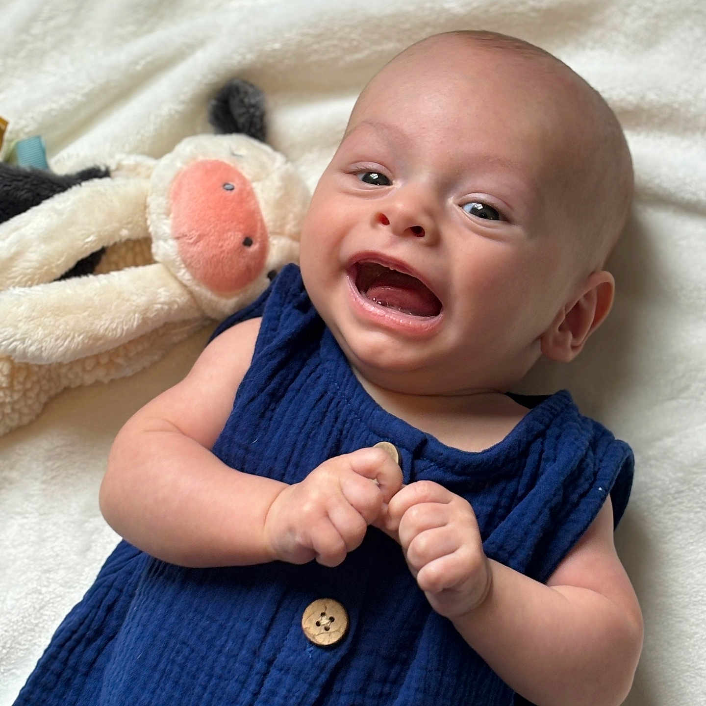 Westyn is registered to the contest to win money with this photo: baby, babylaughing, bed, bodypart, clothing, dress, face, finger, hand, happy, head, laughing, newborn, pants, person, photography, portrait, quilt, smile, toy