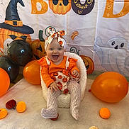 Brittany joined the competition — help win amazing prizes! baby, background, balloon, black, chair, child, costume, cute, decoration, festive, ghost, halloween, happy, headband, holiday, indoor, orange, pumpkin, smile, tights