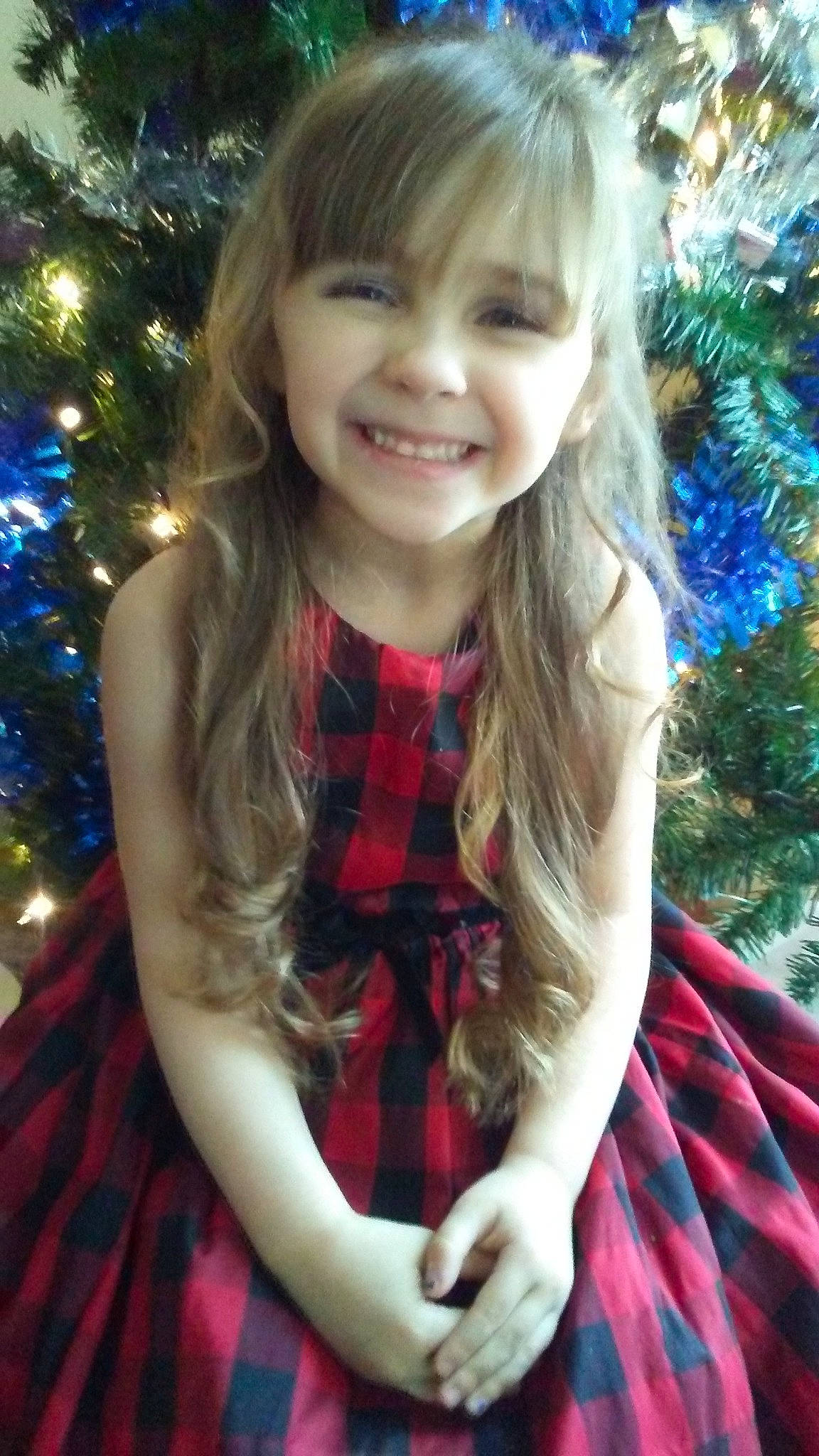 Allianna joined the competition — help win amazing prizes! bangs, blond, brown_hair, child, child_model, christmas, christmas_eve, design, fawn, hair, hair_coloring, hairstyle, holiday, joy, long_hair, pattern, person, plaid, smile, tartan